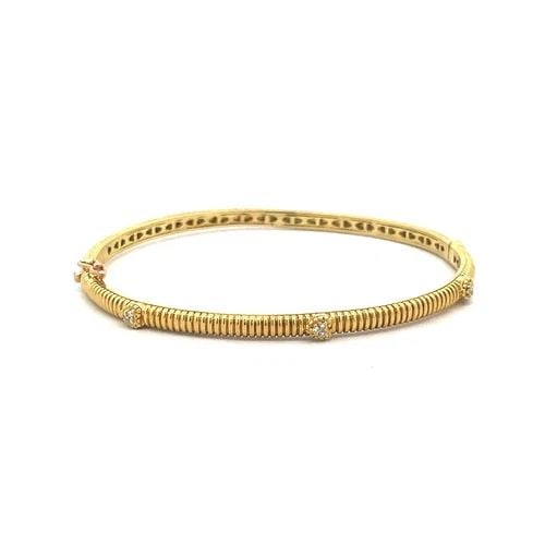 JUDITH RIPKA DIAMOND GOLD BANGLE 18K YELLOW SLIM GROOVED HEARTS MOTIFS: JUDITH RIPKA DIAMOND GOLD BANGLE 18K YELLOW SLIM GROOVED HEARTS MOTIFS This elegant authentic bangle is by Judith Ripka, it is crafted from 18k yellow gold featuring a 3mm wide slim band with a full c