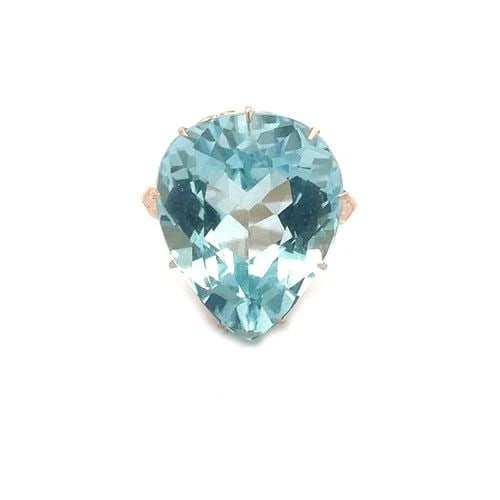 AQUAMARINE GOLD RING 12K YELLOW FILIGREE BRIDGE PEAR SHAPE: AQUAMARINE GOLD RING 12K YELLOW FILIGREE BRIDGE PEAR SHAPE The Aquamarine Gold Ring is a stunning piece of fine jewelry featuring a beautiful large aquamarine stone in a pear shape, set in 12k yellow 