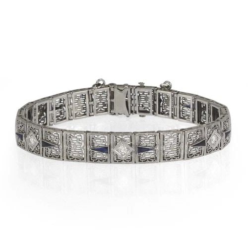 DIAMOND GOLD BRACELET FILIGREE 14K WHITE ART DECO: Art Deco Diamond 14k White Gold Filigree Bracelet Description This gorgeous Art Deco bracelet is crafted from 14k white gold with slide clasp and chain attached for worry free wear. Along the 10mm wid