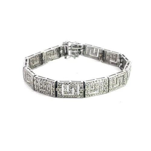 7482 DIAMOND GOLD BRACELET 14K WHITE PAVE SET GREEK KEY LINK STYLE: 7482 DIAMOND GOLD BRACELET 14K WHITE PAVE SET GREEK KEY LINK STYLE This beautiful diamond bracelet features a classic Greek Key (or meander) design rectangle shaped links. Made with 14k white gold and