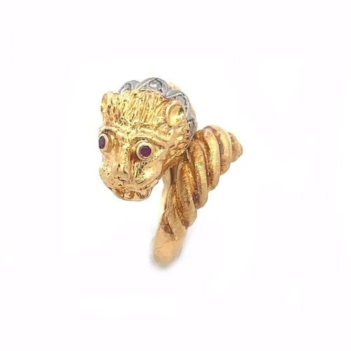 DIAMOND 18K GOLD LION HEAD RING GOLD COLLAR RUBY BYPASS STYLE MYTHICAL: DIAMOND 18K GOLD LION HEAD RING GOLD COLLAR RUBY BYPASS STYLE MYTHICAL This is a Greek style lion head ring crafted from 18k yellow gold with a rose cut diamond collar around the lion's neck. The back