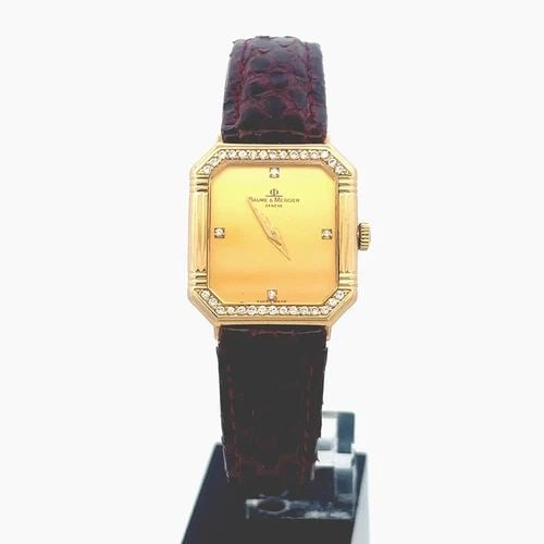 BAUME & MERCIER LADIES WATCH VINTAGE 18 KARAT GOLD DIAMOND QUARTZ WATCH: BAUME & MERCIER LADIES WATCH VINTAGE 18 KARAT GOLD DIAMOND QUARTZ WATCH This elegant vintage authentic women wristwatch if by Baum & Mercier, the case is crafted from 18k yellow gold featuring an octa