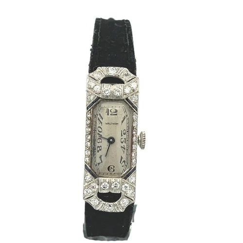 ART DECO DIAMOND PLATINUM HAND WIND ELONGATED LADIES WATCH: ART DECO DIAMOND PLATINUM HAND WIND ELONGATED LADIES WATCH This is a lovely Art Deco platinum hand wind ladies watch, the frame is a rectangle shape with elongated fancy lugs with diamonds around the 