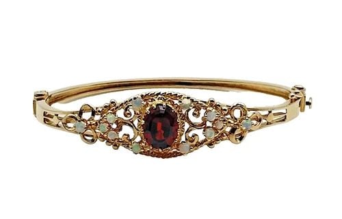 14K YELLOW GOLD BANGLE BRACELET WITH GARNET AND OPALS (7 INCH) 15.5 GRAMS: 14K YELLOW GOLD BANGLE BRACELET WITH GARNET AND OPALS 15.5 GRAMS 14k Yellow Gold Bangle Bracelet with Garnet and Opals Condition: Used Material: 14k Yellow Gold Weight: 15.5 grams Bracelet Size: fits 