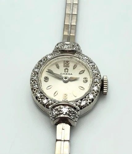 OMEGA WATCH 14K WHITE GOLD CASE AND BAND WITH DIAMOND BEZEL, OMEGA 481 17J MVMT: OMEGA WATCH 14K WHITE GOLD CASE AND BAND WITH DIAMOND BEZEL OMEGA Watch 14k White Gold case and band with Diamond bezel You are bidding on a OMEGA Watch 14k White Gold case and band with Diamond bezel