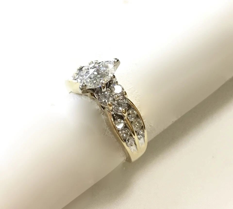 14K GOLD RING, 1.20CTS DIAMONDS, 0.50CT MARQUISE CENTER ( SIZE: 7.75 ) 6.1G: 14K YELLOW GOLD RING WITH DIAMONDS MARQUISE CENTER (SIZE 7.75) 14k Yellow Gold Ring with Diamonds You are bidding on a 14k Yellow Gold Ring with Diamonds. Ring has been fully restored by our in house 