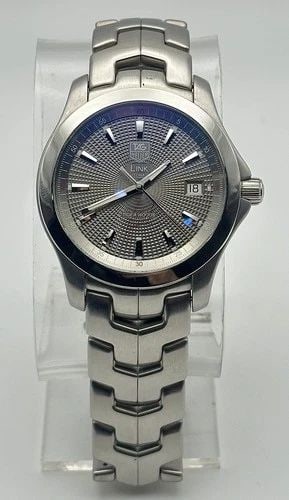 TAG HEUER LINK WJF2113 TIGER WOODS AUTOMATIC WATCH 38MM LIMITED EDITION: TAG Heuer Link WJF2113 Tiger Woods Automatic Watch 38mm Limited Edition Condition: Used, has some marks and scratches on case and band from regular use, original box is damaged. PLEASE LOOK AT PHOTOS 