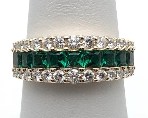EFFY 14K GOLD BAND WITH LAB CREATED EMERALDS AND 0.70CTS NATURAL DIAMONDS SIZE 7: EFFY 14K GOLD BAND WITH LAB CREATED EMERALDS AND 0.70CTS NATURAL DIAMONDS SIZE 7 EFFY 14k Yellow Gold band with center row of Emeralds and 0.70cts of Diamonds Condition: New, Display Model, no box or 