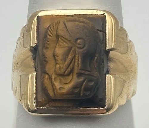 10K GOLD RING SET WITH CAMEO TIGER'S EYE SIZE: 9.5 7 GRAMS: TIGER'S EYE, CAMEO RING 10K GOLD Tiger eye, Cameo Ring 10k Gold You are bidding on a pre-owned Tiger's eye, Cameo Ring 10k Gold. The ring is in excellent condition. Features 10k yellow gold, tiger eye