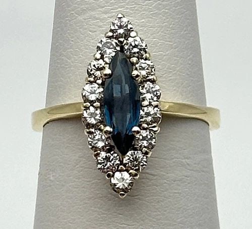 14K YELLOW GOLD RING WITH 0.65CT NATURAL SAPPHIRE AND 0.56CTW VS DIAMONDS 3.5G: 14K YELLOW GOLD RING WITH 0.65CT NATURAL SAPPHIRE AND 0.56CTS OF VS DIAMONDS 14k Yellow Gold Ring with marquise natural Sapphire and 0.56cts of VS Diamonds Condition: Used Material: 14k Yellow Gold Ri