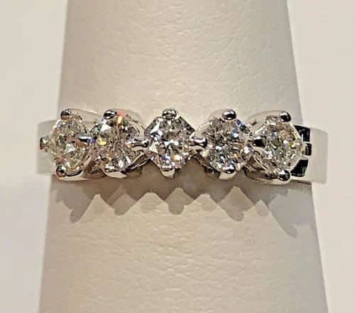 18K WHITE GOLD RING, 0.75CTS OF OCTAGON CUT DIAMONDS ( SIZE: 6 ) 3.4G: 18K WHITE GOLD RING WITH 5 OCTAGON CUT DIAMONDS 0.75CTW SIZE: 6 18k White Gold Ring with upper center row 0.75cts of Diamonds Condition: Display Model, no box or papers (defects are purely cosmetic, v