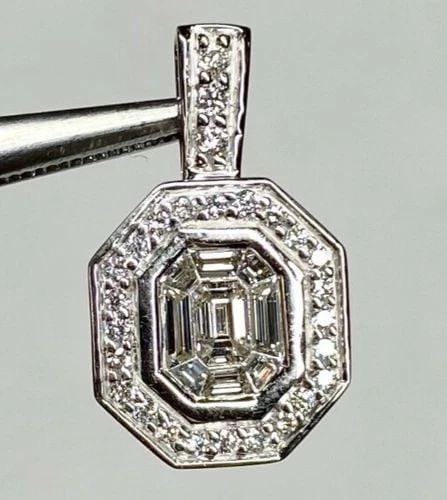 14K WHITE GOLD OCTAGON PENDANT WITH 0.90CTS NATURAL DIAMONDS ( 2.7 GRAMS ): 14k White Gold Octagon Pendant with Diamonds You are bidding on a pre-owned 14k White Gold Octagon Pendant with Diamonds. The pendant has minor scuffs and scratches from normal wear and tear, but over