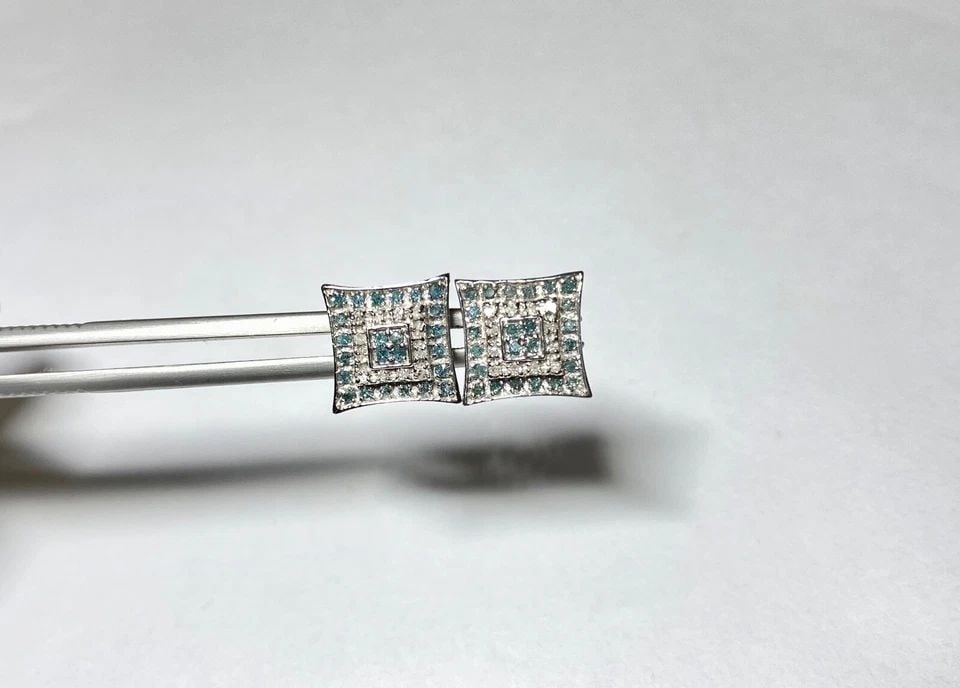 14K WHITE GOLD EARRINGS WITH 1.20CTW BLUE AND WHITE DIAMONDS 3.5 GRAMS: 14K WHITE GOLD EARRINGS WITH 1.20CT BLUE AND WHITE DIAMONDS 14k White Gold Earrings with 1.20CT Blue and White Diamonds You are bidding on a new with tags 14k White Gold Earrings with 1.20CT Blue and 