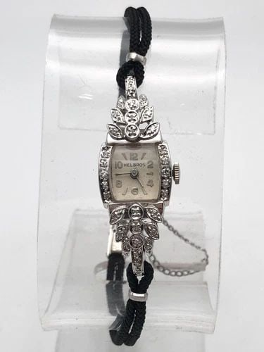 VINTAGE LADIES 14K WHITE GOLD, HELBROS WATCH WITH 0.25CTS OF DIAMONDS: Vintage Ladies 14k White Gold, Helbros Watch with 0.25cts of Diamonds Condition: Vintage Used Material: Case and back are solid 14k White Gold (NOT plated/filled). Contains 6.0 grams of 14kt white gol