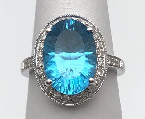 14K WHITE GOLD RING WITH BLUE TOPAZ, 0.45CTW DIAMONDS (SIZE 7.25) 4.9 GRAM: 14K WHITE GOLD RING WITH CENTER BLUE TOPAZ AND 0.45CTS DIAMONDS SIZE: 7.25 14k White Gold Ring with center Blue Topaz and 0.45cts of Diamonds Condition: Display Model, No box or papers Material: 14k W