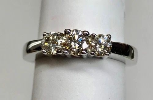 NEW 14K WHITE GOLD 3 STONE RING WITH 3/4CT DIAMONDS (SIZE 7) 4.1 GRAMS: WOMEN'S 14K WHITE GOLD THREE STONE RING WITH 3/4CT DIAMONDS (SIZE 7) Women's 14k White Gold Three Stone Ring with 3/4ct Diamonds (Size 7) You are bidding on a new with tags Women's 14k White Gold Thre
