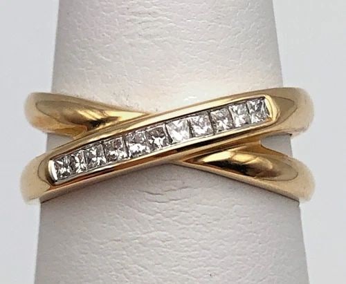 NEW 14K X STYLE RING WITH 0.25CTW PRINCESS CUT DIAMONDS (SIZE 7) 4 GRAMS: 14k X style Ring set with 0.25cts of Diamonds Condition: New with original tag, has been moved around in inventory Material: 14k Yellow Gold Ring Size: 7 Weight: 4 grams Top Width: 7.2mm Bottom Width: