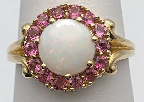 14K YELLOW GOLD RING SET WITH 1CT OPAL AND PINK CUBIC ZIRCONIA (SIZE 7.5) 4.4G: 14K YELLOW GOLD RING SET WITH OPAL AND PINK CUBIC ZIRCONIA SIZE: 7.5 14k Yellow Gold Ring set with Opal and Pink Cubic Zirconia Condition: Used, has been moved around in inventory Material: 14k Yellow