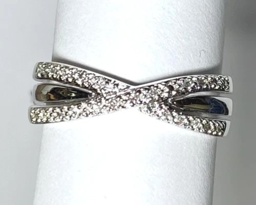 NEW 14K WHITE GOLD X STYLE RING WITH 0.15CTW DIAMONDS (SIZE 7.25) 4.1G: WOMEN'S 14K WHITE GOLD RING WITH 0.15CT DIAMONDS (SIZE 7.25) Women's 14k White Gold Ring with 0.15CT Diamonds (Size 7.25) You are bidding on a new with tags Women's 14k White Gold Ring with 0.15CT Dia
