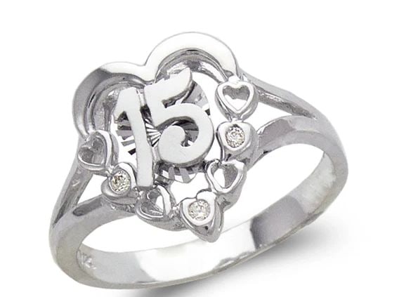 NEW 14K WHITE GOLD LADIES FANCY WHITE 15 ANOS RING: NEW 14K WHITE GOLD LADIES FANCY WHITE 15 ANOS RING LADIES FANCY WHITE 15 ANOS RING NEW 14K WHITE GOLD Apx. WIDTH: 13mm Apx. WEIGHT: 3.8g