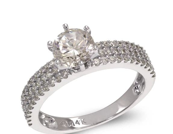 NEW 14K WHITE GOLD LADIES FANCY WHITE SOLITAIRE RING: NEW 14K WHITE GOLD LADIES FANCY WHITE SOLITAIRE RING LADIES FANCY WHITE SOLITAIRE RING NEW 14K WHITE GOLD Apx. WIDTH: 6mm Apx. WEIGHT: 3.4g