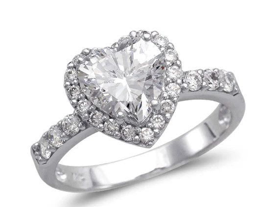 NEW 14K WHITE GOLD LADIES FANCY WHITE HEART HALO SOLITAIRE RING: NEW 14K WHITE GOLD LADIES FANCY WHITE HEART HALO SOLITAIRE RING LADIES FANCY WHITE HEART HALO SOLITAIRE RING NEW 14K WHITE GOLD Apx. WIDTH: 11mm Apx. WEIGHT: 3.3g
