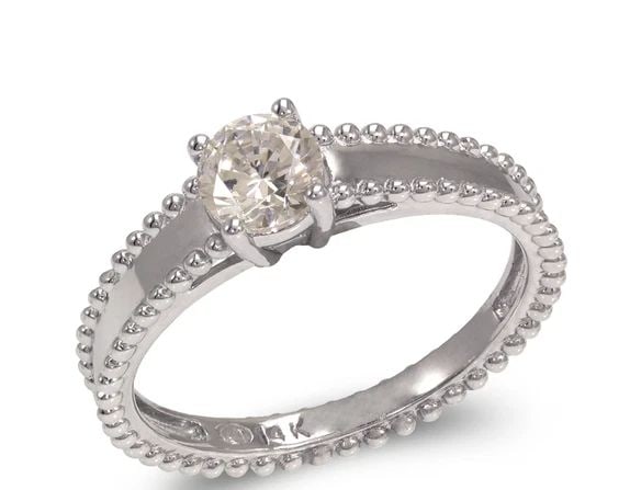 NEW 14K WHITE GOLD LADIES FANCY WHITE SOLITAIRE RING: NEW 14K WHITE GOLD LADIES FANCY WHITE SOLITAIRE RING LADIES FANCY WHITE SOLITAIRE RING NEW 14K WHITE GOLD Apx. WIDTH: 5mm Apx. WEIGHT: 3.1g