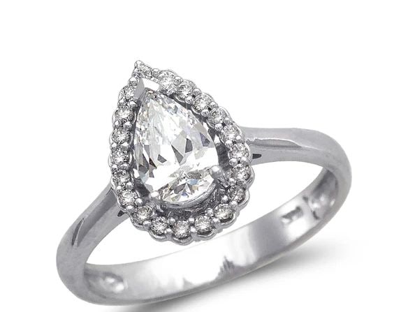 NEW 14K WHITE GOLD LADIES FANCY WHITE TEARDROP SOLITAIRE RING: NEW 14K WHITE GOLD LADIES FANCY WHITE TEARDROP SOLITAIRE RING LADIES FANCY WHITE TEARDROP SOLITAIRE RING NEW 14K WHITE GOLD Apx. WIDTH: 12mm Apx. WEIGHT: 2.9g
