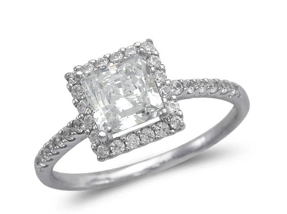 NEW 14K WHITE GOLD LADIES FANCY WHITE PRINCESS CUT HALO SOLITIARE RING: NEW 14K WHITE GOLD LADIES FANCY WHITE PRINCESS CUT HALO SOLITIARE RING LADIES FANCY WHITE PRINCESS CUT HALO SOLITIARE RING NEW 14K WHITE GOLD Apx. WIDTH: 9mm Apx. WEIGHT: 2.6g