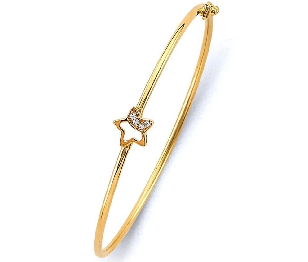 NEW 14K YELLOW GOLD BABY FLEXIBLE BANGLE WITH STAR: NEW 14K YELLOW GOLD BABY FLEXIBLE BANGLE WITH STARFLEXIBLE BANGLE WITH STARNEW 14KYELLOW GOLDC ZLENGTH - 7inApx WEIGHT - 1.9g.