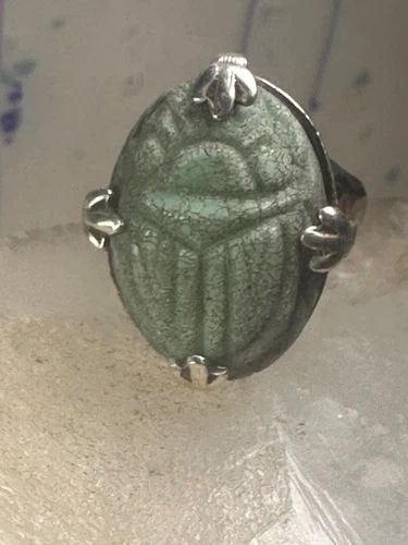 SCARAB RING CARVED STONE ADJUSTABLE SIZE 8.75 STERLING SILVER WOMEN: SCARAB RING CARVED STONE ADJUSTABLE SIZE 8.75 STERLING SILVER WOMEN Scarab ring adjustable size 8.75 sterling silver women Size 8.75 Weight g Length. 1. 1/8" Width 3/4" Thinnest part of band 5/32"