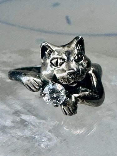 SMILING CAT RING CRYSTAL CZ KBN KABANA BAND SIZE 5 STERLING SILVER WOMEN GIRLS: SMILING CAT RING CRYSTAL CZ KBN KABANA BAND SIZE 5 STERLING SILVER WOMEN GIRLS Smiling Cat ring crystal CZ KBN Kabana band size 5 sterling silver women girls Size 5 Weight 4.1g Length 1/2" Width 3/8" 