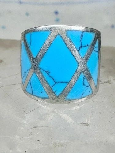 TURQUOISE RING SIZE 5.25 CIGAR BAND STERLING SILVER WOMEN: Turquoise ring size 5.25 cigar band sterling silver women Size 5.25 Weight 7.6g Width. 5/8" Thinnest part of band 1/4"