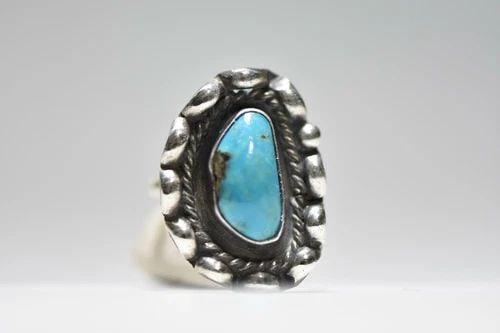 LONG NAVAJO RING TURQUOISE STERLING SILVER WOMEN: LONG NAVAJO RING TURQUOISE STERLING SILVER WOMEN Long Navajo ring turquoise sterling silver women size 6.50 weight 6.4g Widest part of band 1 1/8" Thinnest part of band 3/32" Delivered in a Gift Box