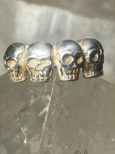 SKULL RING SKULLS BAND STERLING SILVER BIKER WOMEN MEN: SKULL RING SKULLS BAND STERLING SILVER BIKER WOMEN MEN Skull ring skulls band sterling silver biker women men Size 8.75 Weight 6.9g Width 3/8" Thinnest part 3/16"