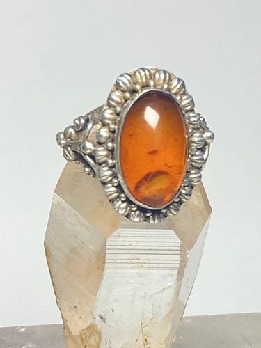 AMBER RING STERLING SILVER PINKY WOMEN: AMBER RING STERLING SILVER PINKY WOMEN Amber ring sterling silver pinky boho women Size. 5.50 Weight 5.2g Length. 7/8" " Width 5/16" Narrowest part of band 1/8"