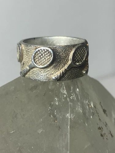 TENNIS RING RACQUET BAND STERLING SILVER WOMEN GIRLS: TENNIS RING RACQUET BAND STERLING SILVER WOMEN GIRLS Tennis ring racquet band sterling silver women girls Size 5.50 Between a size 5.50 and a size 5.75 Weight 7.4g Band Width 3/8"