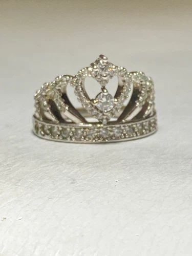 TIARA RING CROWN BAND PRINCESS GIRLS BIRTHDAY STERLING SILVER WOMEN: TIARA RING CROWN BAND PRINCESS GIRLS BIRTHDAY STERLING SILVER WOMEN Tiara ring crown band princess girls birthday sterling silver women Size 7.50 Weight 5.2g Length 3/4" Widest part of tiara 5/8" Thin