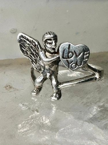 I LOVE YOU RING HEART CUPID VALENTINE SIZE 7.75 STERLING SILVER WOMEN: I LOVE YOU RING HEART CUPID VALENTINE SIZE 7.75 STERLING SILVER WOMEN I Love You ring Heart Cupid Valentine size 7.75 sterling silver women Size 7.75 Weight 4.1g Length 5/8" Width 5/8" Thinnest part o