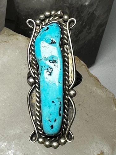 LONG TURQUOISE RING NAVAJO BAND SIZE 7.75 STERLING SILVER WOMEN: LONG TURQUOISE RING NAVAJO BAND SIZE 7.75 STERLING SILVER WOMEN Long Turquoise ring Navajo band size 7.75 sterling silver women Size 7.75 Between a size 7.75 and a size 8 Weight. 12.6g Length 2" Width