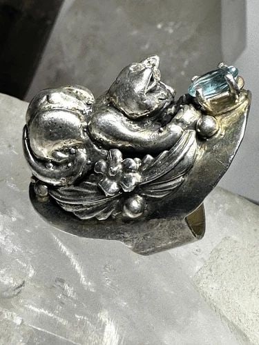 CAT RING CAROL FELLEY BAND SIZE 5 STERLING SILVER: CAT RING CAROL FELLEY BAND SIZE 5 STERLING SILVER Cat Ring Carol Felley band Size 5 Sterling Silver Size 5 Weight 23.8g Length. 1. 1/2" Width 5/8" Back on the band 3/8"