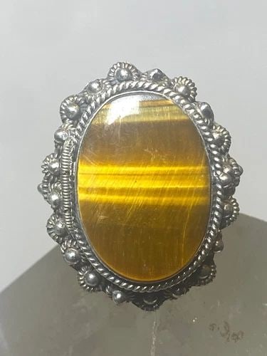 TIGER EYE POISON LOCKET RING SIZE 7.75 MEXICO STERLING SILVER: TIGER EYE POISON LOCKET RING SIZE 7.75 MEXICO STERLING SILVER Tiger Eye poison locket ring size 7.75 Mexico sterling silver The locket closes tight .. jiggles and stays closed as I have been shaking i