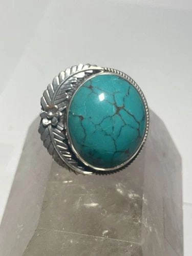 TURQUOISE RING SOUTHWEST STERLING SILVER WOMEN: TURQUOISE RING SOUTHWEST STERLING SILVER WOMEN Navajo ring Turquoise ringlarge round heavy sterling silver women Size 6.75 Weight 34g Length 1 1/2" Width 1 1/2" Thinnest part of band 1/8"