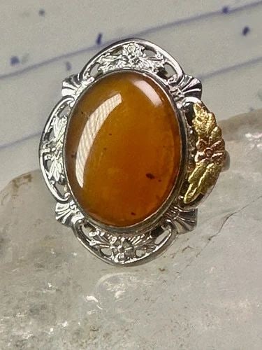 BLACK HILLS GOLD RING LONG STONE LEAVES SIZE 7.50 STERLING SILVER WOMEN GIRLS: BLACK HILLS GOLD RING LONG STONE LEAVES SIZE 7.50 STERLING SILVER WOMEN GIRLS Black Hills Gold ring large stone leaves size 7.50 sterling silver women girls Size. 7.50 Between. size 7.50 and a size 7.