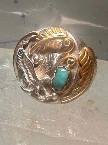 NAVAJO EAGLE RING TURQUOISE BAND SIZE 14.50 STERLING SILVER MEN WOMEN: NAVAJO EAGLE RING TURQUOISE BAND SIZE 14.50 STERLING SILVER MEN WOMEN Navajo Eagle ring turquoise band size 14.50 sterling silver men women Size. 14.50 Weight 20.1g Length 1" Width 7/8" Thinnest part 