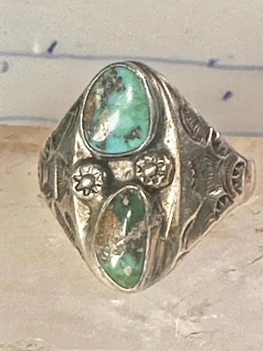 NAVAJO RING TURQUOISE STAMPINGS SIZE 14 STERLING SILVER WOMEN MEN: NAVAJO RING TURQUOISE STAMPINGS SIZE 14 STERLING SILVER WOMEN MEN Navajo ring turquoise stampings size 14 sterling silver women men Size 14 Weight. 15g Length 1" Width 1/2" Thinnest part of band.5/32"