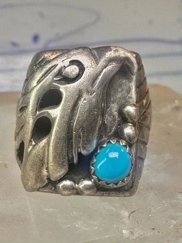 NAVAJO RING EAGLE BAND TURQUOISE SIZE 11 STERLING SILVER WOMEN MENSIGNED W LOGO: NAVAJO RING EAGLE BAND TURQUOISE SIZE 11 STERLING SILVER WOMEN MENSIGNED W LOGO Navajo ring eagle band turquoise size 11 sterling silver women men Size 11 Weight 26.3g Length 7/8" Width 5/8" Thinnest 