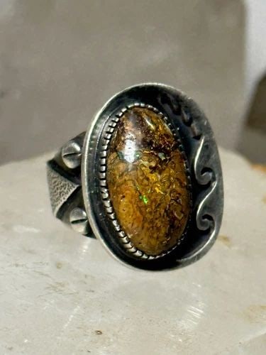 BOULDER OPAL NAVAJO RING SIZE 5.25 STERLING SILVER WOMEN: BOULDER OPAL NAVAJO RING SIZE 5.25 STERLING SILVER WOMEN Boulder Opal Southwestern ring size 5.25 sterling silver women Size 5.25 Weight 14.7g Length 7/8" Widest 3/4" Thinnest part. 1/4"