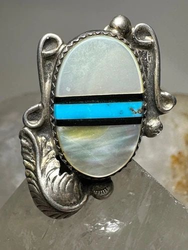 LONG NAVAJO RING TURQUOISE MOP LEAF FEATHER SIZE 6.25 STERLING SILVER WOMEN: LONG NAVAJO RING TURQUOISE MOP LEAF FEATHER SIZE 6.25 STERLING SILVER WOMEN Long Navajo ring turquoise MOP leaf feather size 6.25 sterling silver women Signed perhaps QC See photos Hard to tell Size 6