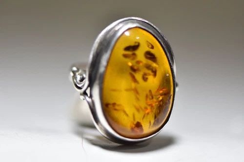 AMBER RING VINTAGE LONG STERLING SILVER WOMEN ART DECO: AMBER RING VINTAGE LONG STERLING SILVER WOMEN ART DECO Amber ring long sterling silver women Influenced by the Arts and Crafts Movement Size 6.75 Weight 9.6g length of front of ring 1 1/4" Width of th